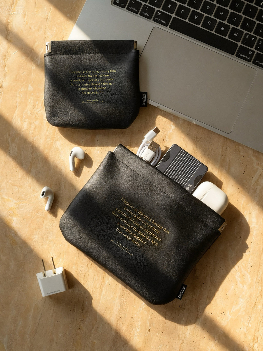 Automatic closure cosmetic organizer bag, travel-friendly, for storing data cables, miscellaneous items, passports, and coins.